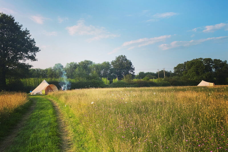 Glamping bell tent in a feild with woodsmoke, Kent